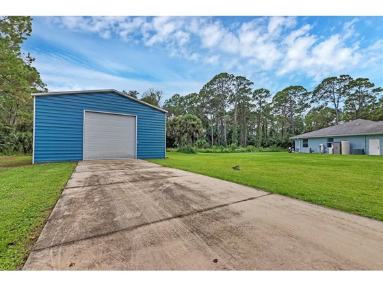 Single Family Home for sale at 1891 Tropicaire Blvd, North Port, FL 34286 - MLS Number is D6121425