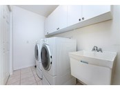 LAUNDRY ROOM WITH STORAGE AND SINK - Single Family Home for sale at 3400 Colony Ct, Punta Gorda, FL 33950 - MLS Number is C7451906