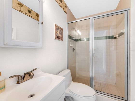 Bathroom off of the efficiency. - Condo for sale at 6810 Midnight Pass Rd, Sarasota, FL 34242 - MLS Number is A4507853