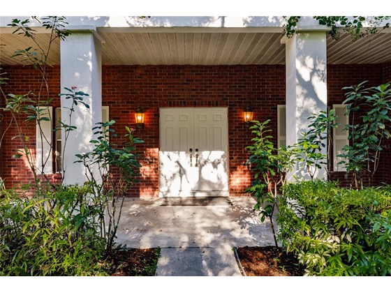 Pillars flank the front doors - Single Family Home for sale at 7700 Iguana Dr, Sarasota, FL 34241 - MLS Number is A4512842