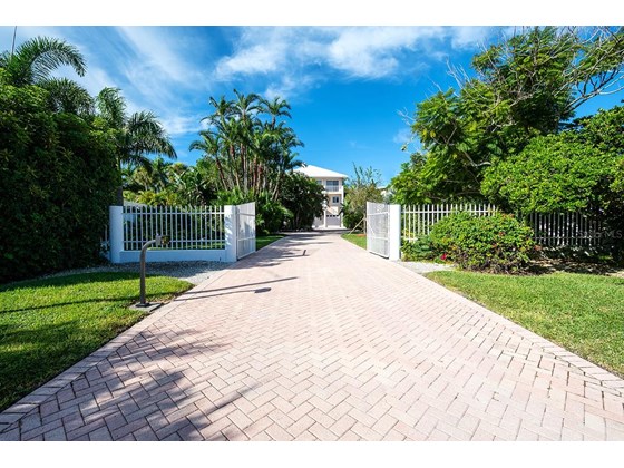 Privacy gate to the  mini estate on the beach - Single Family Home for sale at 113 N Polk Dr, Sarasota, FL 34236 - MLS Number is A4514338