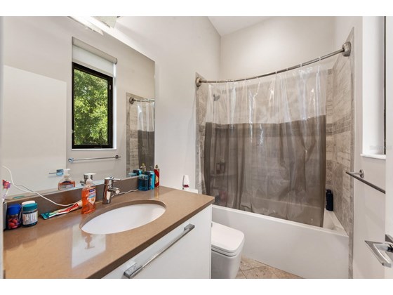 Bathroom in attached suite - Single Family Home for sale at 1899 Vamo Way, Sarasota, FL 34231 - MLS Number is A4515367