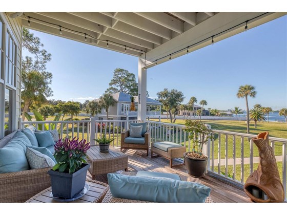 2nd level Porch facing Pool House and bay - Single Family Home for sale at 6751 Portside Ln, Englewood, FL 34223 - MLS Number is N6118322