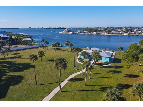 Community Pool House on the bay - Single Family Home for sale at 6751 Portside Ln, Englewood, FL 34223 - MLS Number is N6118322